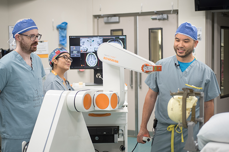 Dr. Lau and team with the robot