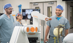 Dr. Lau and team with the robot